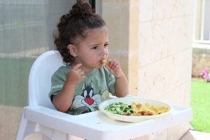 kid on baby chair
