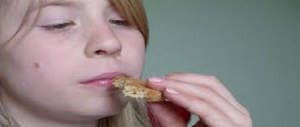 girl eating bread